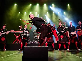 A picture of the Red Hot Chilli Pipers band on stage.