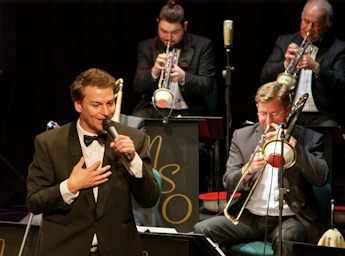 A picture of the Big Band performing on stage.