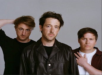 A picture of the Wombats ( 3 men).
