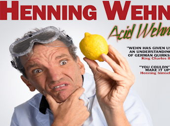 A picture of Henning Wehn holding a lemon.