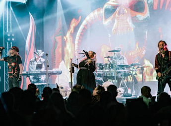 A picture of the Trigger band performing on stage.