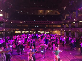 People dancing in the Tower's ballroom.
