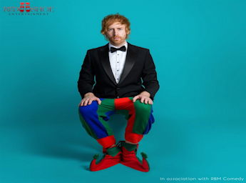 Picture of Mark Simmons half dressed as a jester. 