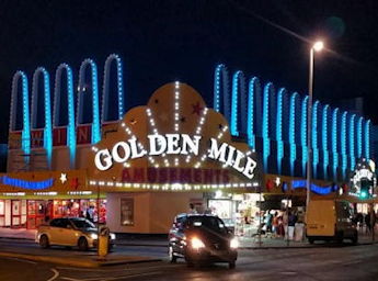 Front of Golden Mile arcade at night time