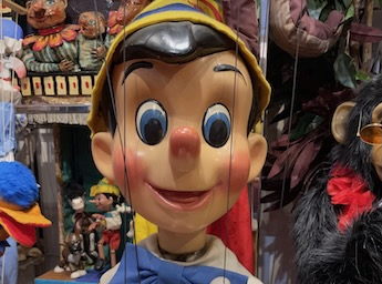 A picture of a Pinocchio string puppet.