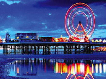 South face of the Central Pier at night. The big wheel is illuminated.