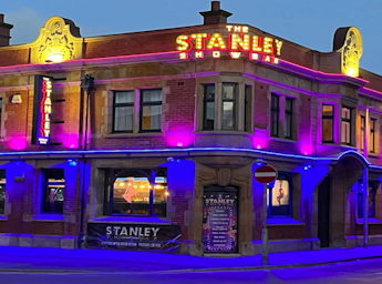 Front of the stanley showbar at night.