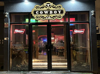 Front of the Cowboy bar at night. 