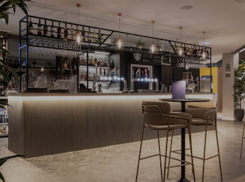 A picture of the bar and a table in front of it.
