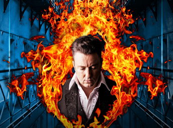 A pciture of Clive as Johnny Cash and surrounded by flames.
