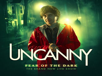 A picture of Danny Robins on a street at night.