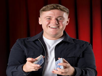 A picture of Harry Moulding shuffling playing cards.