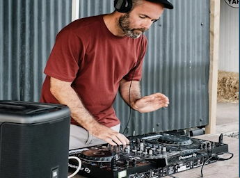 A picture of Fraser Todd with his DJ table.